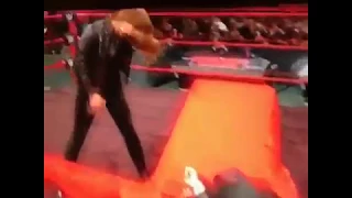 Ronda Rousey Slams Triple H through a table at WWE Elimination Chamber!