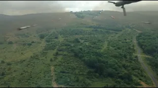 Mi-24 HIND helicopter shooting rockets from gunner view