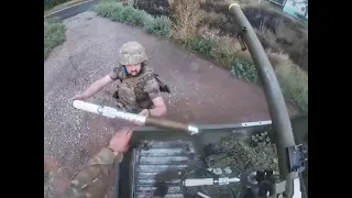 Ukraine soldiers fire an SPG-9 recoilless rifle mounted in the bed of a pickup truck