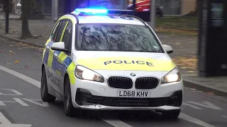 Metropolitan Police car responding with siren and lights