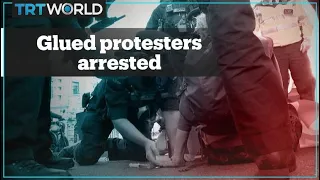 Activists glue their hands during protest, get arrested along with others in London