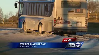 Metro bus gets stuck on icy road after water main break