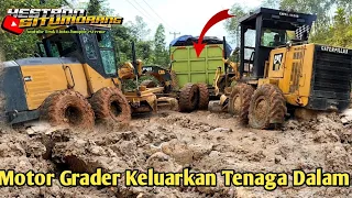 Two motor graders release their internal power when in the mud