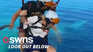 Thrill-seeking tourist has been filmed being SICK - while paragliding! 🪂🤮 | SWNS