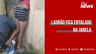 Ladrão tenta furtar mercearia, fica preso em janela e é encontrado de cueca; VÍDEO