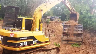 Cat 312B Excavator Loading Truck