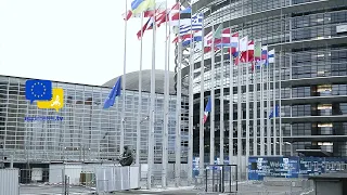 European flags at half mast in front of the European Parliament building in Strasbourg, France