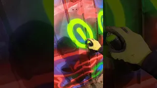 Neon Street Art Squirrel On Garage Door In South London - Fat Cap Sprays