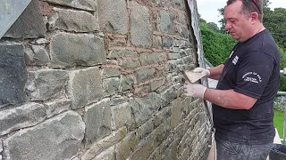 Re pointing using a pointers hod on an un even stone wall with lime mortar tips for beginners