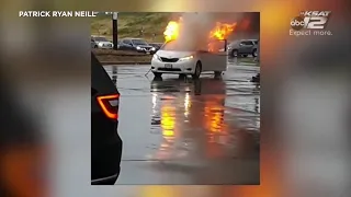 Van bursts into flames after coming into contact with downed power line