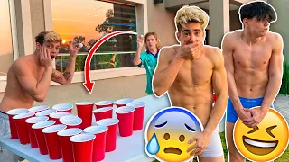 WE THROW BALLS INTO GLASSES (IF YOU LOSE YOU TAKE OFF YOUR CLOTHES !!)