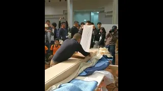 A competition to see who peels the thinnest sheet from a plane of wood