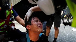 Hong Kong: Protesters sing God Save the Queen as they face off with riot police
