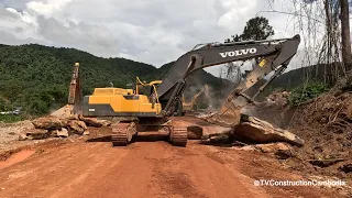 Volvo EC350D Excavator Moving Big Rocks And Hammer Excavator To Break Rock On Side Of Mountain
