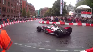 Jenson Button drives the McLaren MP4 23 around Manchester