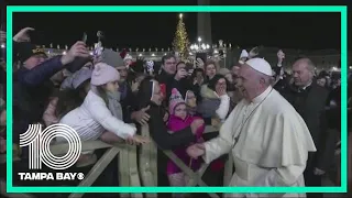 Pope slaps woman's hand after she yanks his arm