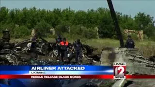 Train with plane crash bodies leaves Ukrainian rebel town