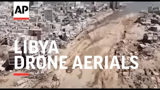 Drone aerials show collapsed dam near Derna in Libya and devastation caused by floods