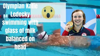 Olympian Katie Ledecky swimming with glass of milk balanced on head