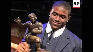 New Orleans Saints running back Reggie Bush said Tuesday that he is giving back his Heisman Trophy a