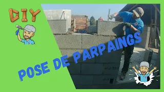 Construire sa maison, Comment poser des parpaings, utilisation d'un fil à plomb.