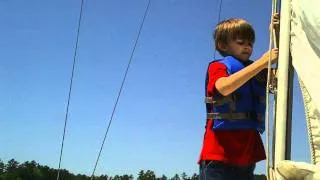 Blake hoisting the mainsail