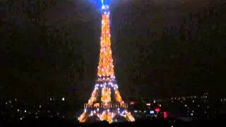 Eiffel Tower lights on a slightly foggy night