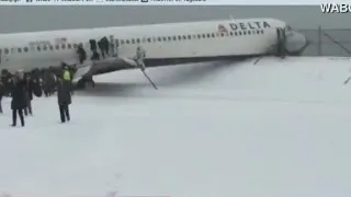 Plane skids off runway at LGA