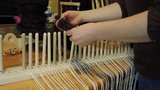 Producing a rug on a homemade peg loom