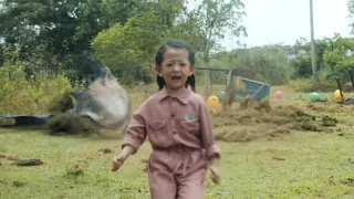 The little girl is swinging, but she doesn't know that the shark is approaching from behind!