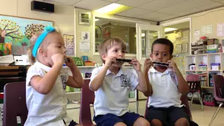 Montessori Children Playing The Harmonica