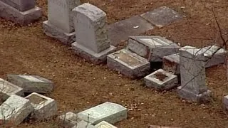 Jewish cemetery vandalized, JCCs receive bomb threats