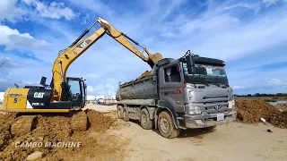 Action Excavator Kobelco digging soil onto Trucks, Dump truck carry soil to clear land for building