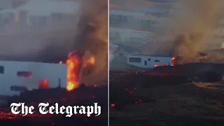 Building catches fire after a volcano erupts in Iceland