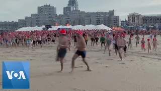 New Year’s Day Swimmers Dip into Dutch Waves | VOA News