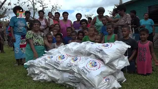Fijian Prime Minister distributes food rations and relief packages to villagers in Wainunu, Bua