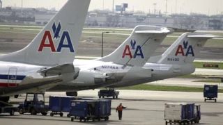 Australian man sues American Airlines for $100000 after getting crushed by two obese travellers