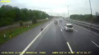 Cuts across 3 lanes of traffic roadworks in the wet