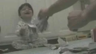 Baby Ripping Paper and Laughing
