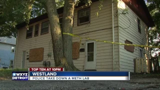Police bust meth lab on street where families live