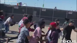 Huge crowd pushes their way through entrance gates at Astroworld festival