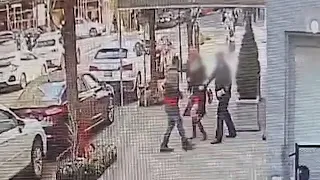 Doorman saves woman from attack by thieves