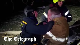 Ukrainian firefighter weeps after learning father was killed in Russian strike