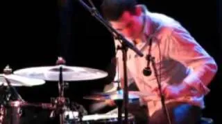 Mark Guiliana plays a drum solo.