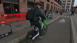 Cyclist drops phone!