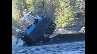 dozer boat being lifted by air crane in Rivers Inlet