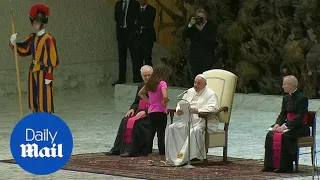 Pope gives sick girl free run of stage as he delivers his sermon