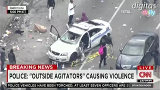 Rioters Take Selfies And Photos With Destroyed Police Car In Baltimore