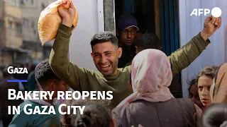 Palestinians wait for hours outside reopened bakery in Gaza City | AFP