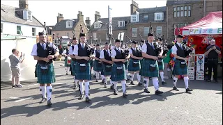 Newtonhill Pipe Band march in to start 2023 Stonehaven Feein' market in Aberdeenshire, Scotland